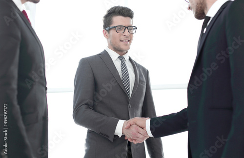 close up.young businessman shaking hands with investor © ASDF