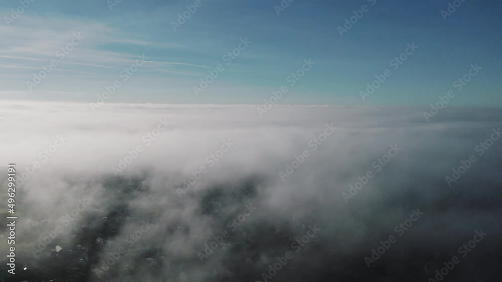 AERIAL: Flight above clouds showing pockets of housing estate, Gower, 4k Drone AERIAL: Flight above clouds showing pockets of housing estate, Gower, 4k Drone