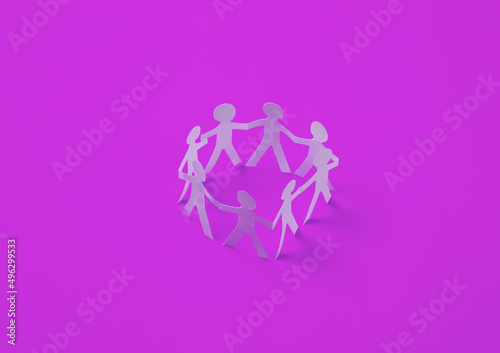 Cut paper human chain hold hands and show their unity on pink background. Solidarity and peace