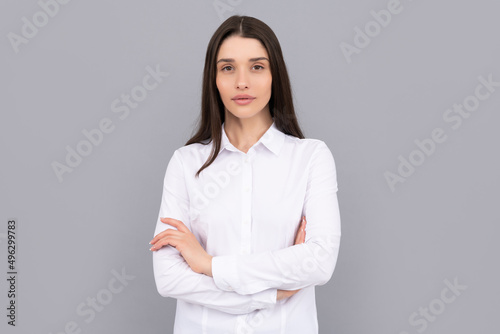 businesswoman in white shirt on grey background, business