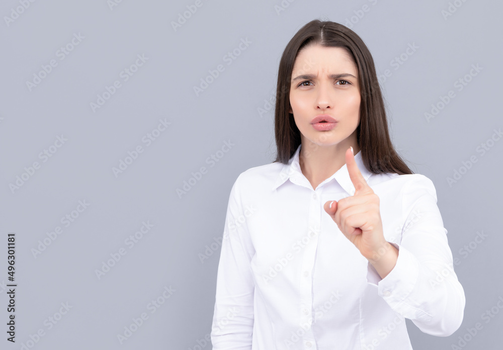 strict businesslike woman in white shirt on grey background, portrait strict businesslike woman in white shirt on grey background, portrait