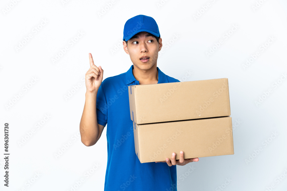 Delivery Chinese man isolated on white background intending to realizes the solution while lifting a finger up Delivery Chinese man isolated on white background intending to realizes the solution while lifting a finger up