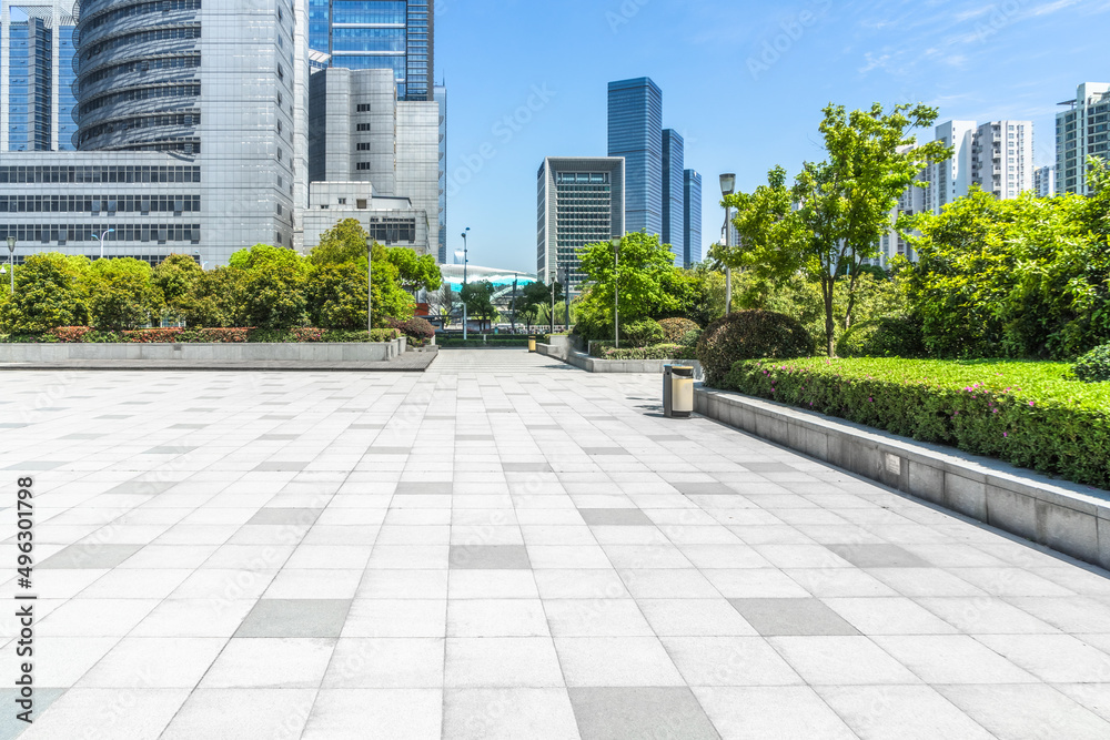 modern buildings and empty pavement in china modern buildings and empty pavement in china