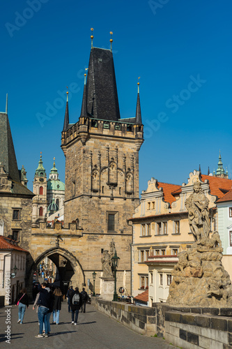 Beautiful view of the Charles Bridge in Prague, Czech Republic at the end of March. Cold sunny spring.