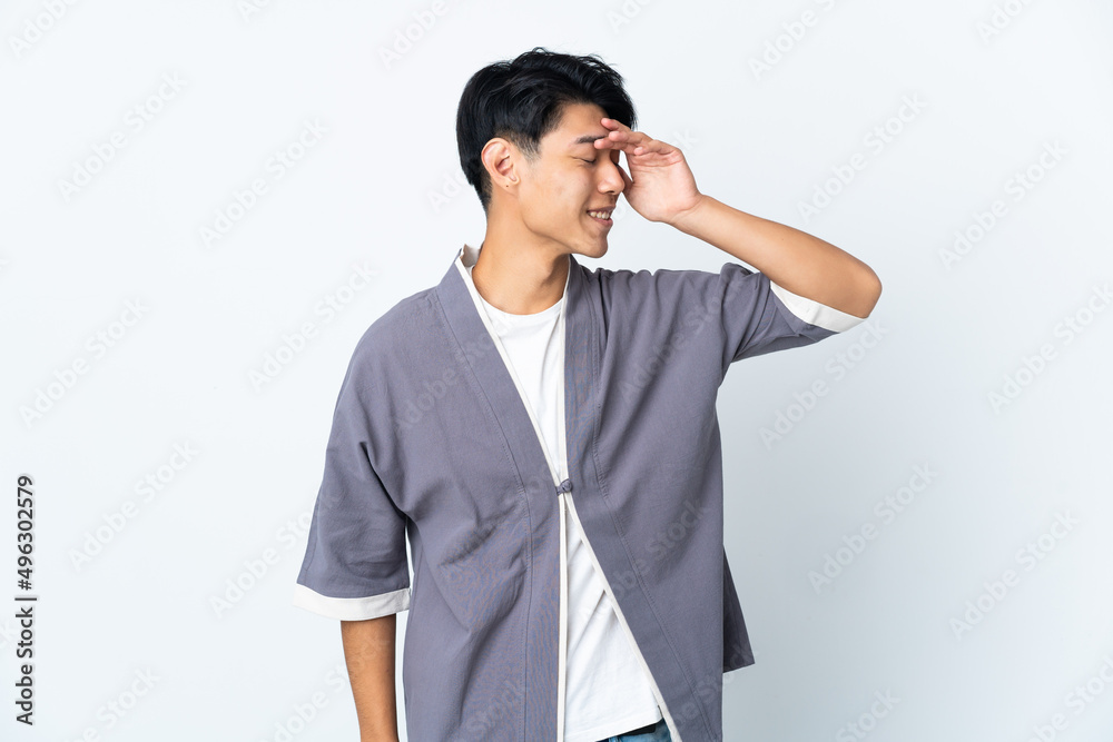 Young Chinese man isolated on white background smiling a lot Young Chinese man isolated on white background smiling a lot