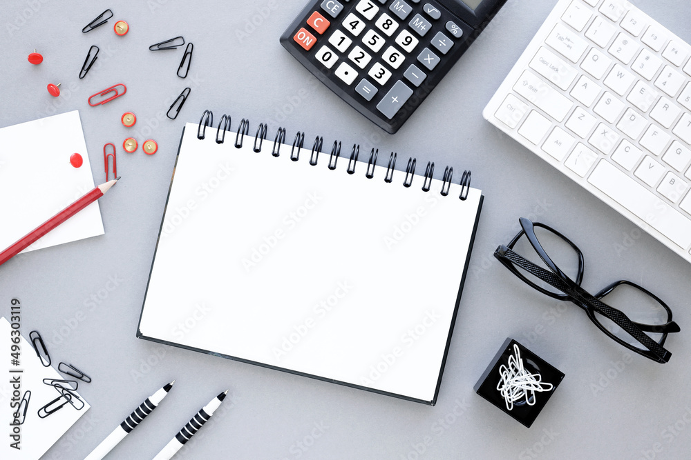 Blank spiral notepad on a gray background. with place for text Blank spiral notepad on a gray background. with place for text