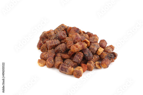Bee bread isolated on a white background. Pile of granules bee bread isolated. Scattered Perga