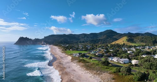 Morning sun aerial over Whiritoa township and surf club on a beautiful day photo