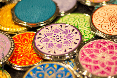 handmade boxes on the counter at the fair. hand-painted national patterns