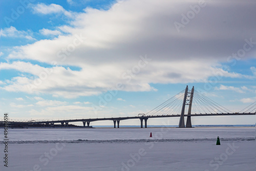 Modern bridge over the river in the urban city in winter 