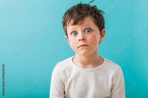 Amazed boy in light studio