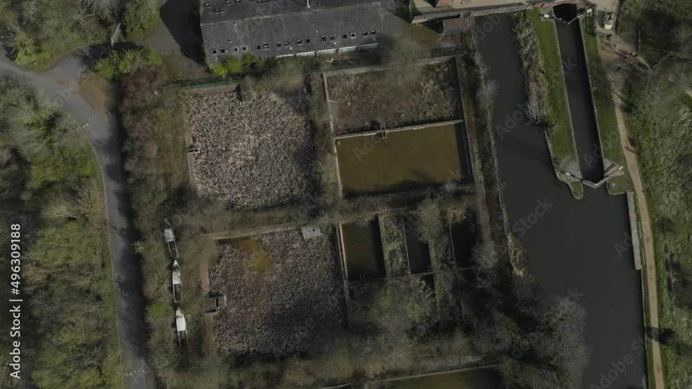 Birds-Eye-View Of Old Water Treatment Works By Avon Canal, Aerial Overhead, Open Sewage Pools, UK Spring-Winter Season Pattern, And Shapes Birds-Eye-View Of Old Water Treatment Works By Avon Canal, Aerial Overhead, Open Sewage Pools, UK Spring-Winter Season Pattern, And Shapes