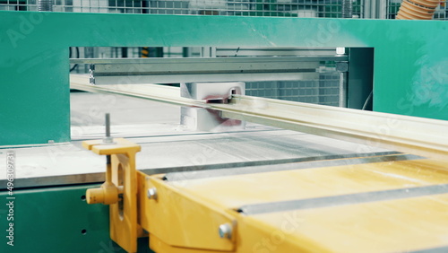 Factory press with a fiberglass frame moving through it