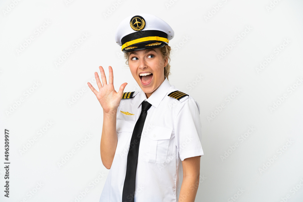 Airplane blonde woman pilot isolated on white background counting five with fingers Airplane blonde woman pilot isolated on white background counting five with fingers