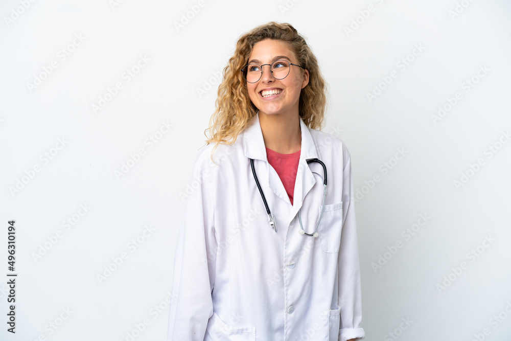 Young doctor blonde woman isolated on white background thinking an idea while looking up Young doctor blonde woman isolated on white background thinking an idea while looking up