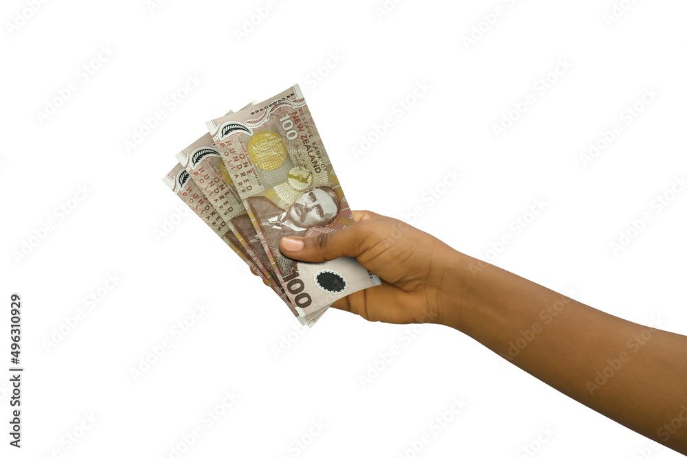 Fair hand holding 3D rendered 100 New Zealand dollar notes isolated on white background Fair hand holding 3D rendered 100 New Zealand dollar notes isolated on white background