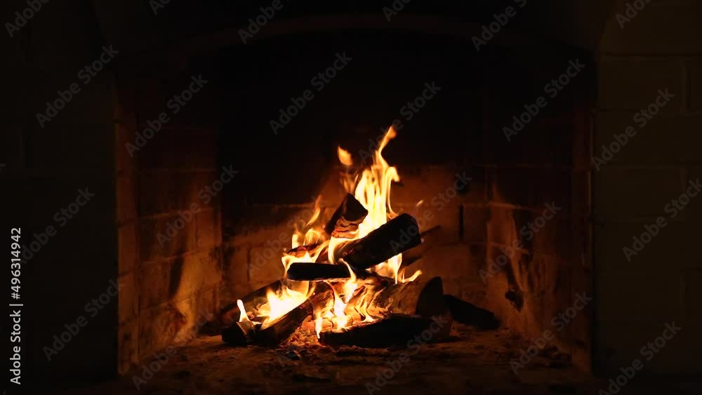 Warm Cozy Fireplace with Real Wood Burning in it. Cozy Winter Concept. Slow Motion. A Looping Clip of a Fireplace with Medium Size Flames