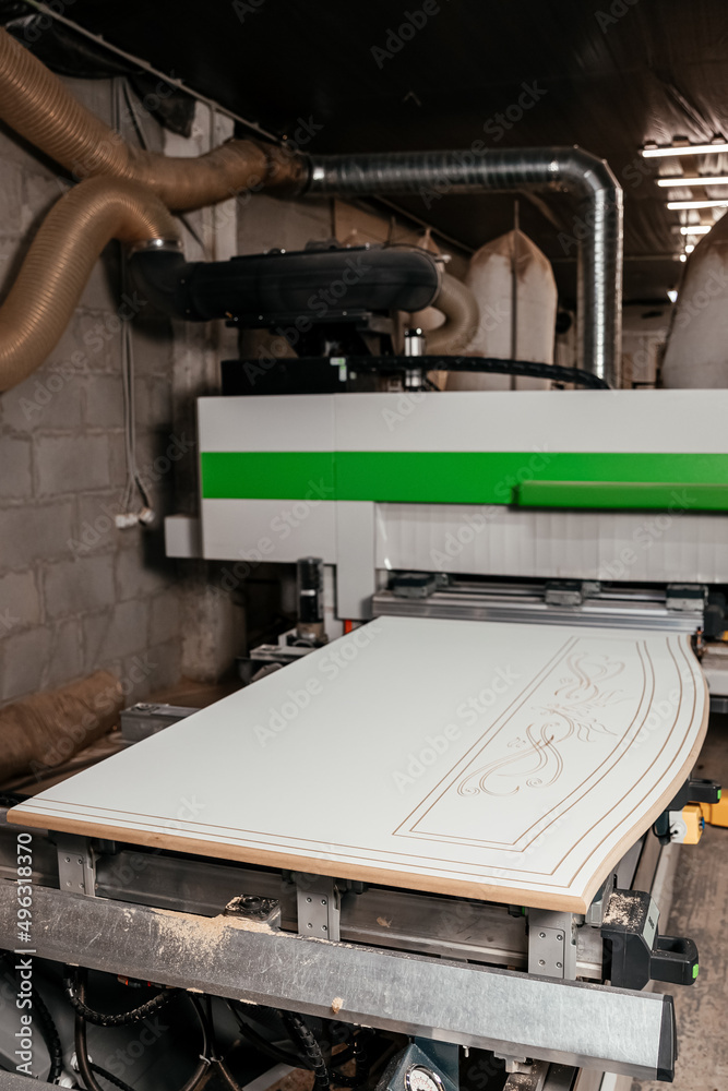 Fototapeta premium 07.07.2018 Lviv, Ukraine: large furniture machine for processing and printing on furniture boards