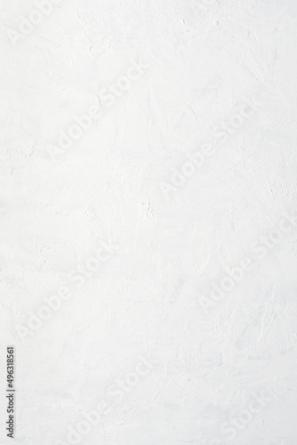 White painted uneven plaster stucco wall abstract texture background