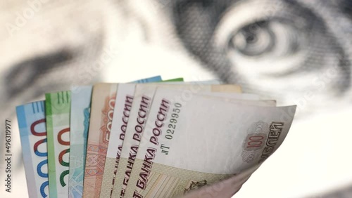 GERMANY - APR 01 2022: Russian Rubels on dollar as background