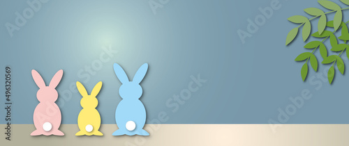 Colourful rabbit family with table, leaf and moonlight on blue sky background, Holiday illustration for greeting card of Happy Easter’s Day, space for the text. paper cut design style.