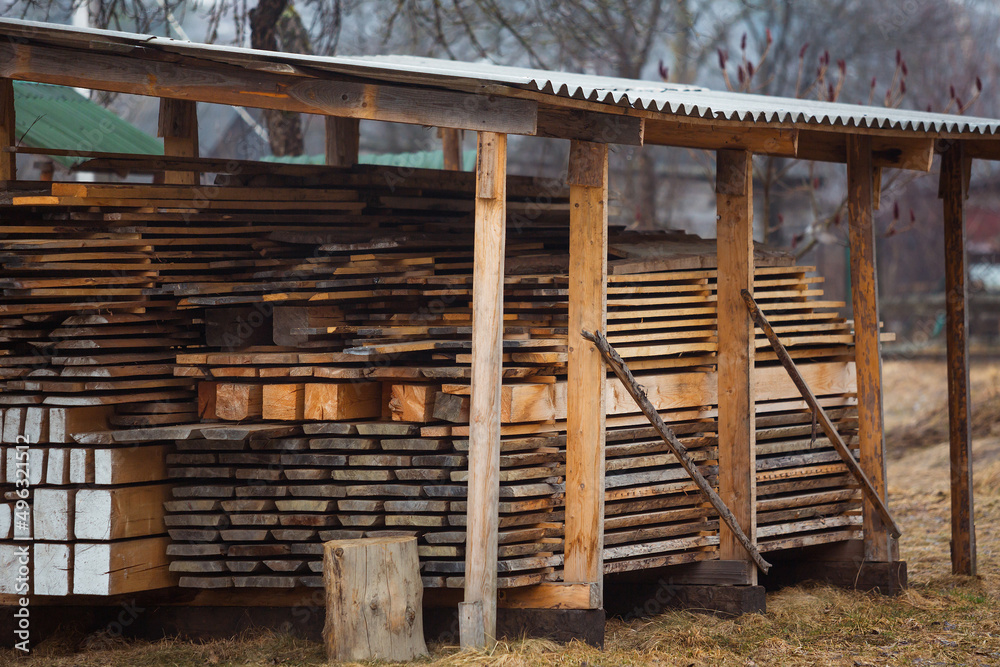 Obraz premium Detail wooden planks. Air-drying timber stack. Wood air drying, seasoning lumber or wood seasoning.