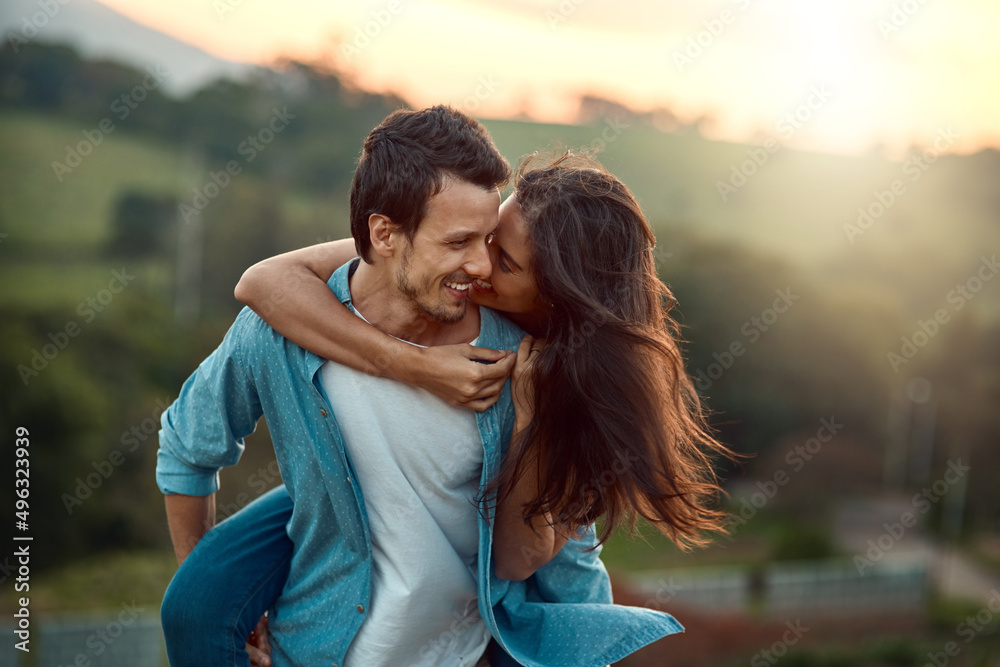 Its just you and me, babe. Cropped shot of a handsome young man piggybacking his girlfriend while spending some time outdoors. Its just you and me, babe. Cropped shot of a handsome young man piggybacking his girlfriend while spending some time outdoors.