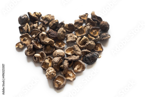 dried shiitake mushrooms in the shape of a heart on a white background