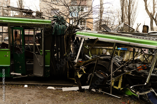 The trolleybus was destroyed on the street after Russian shelling. consequences of the war in Ukraine. broken transport.