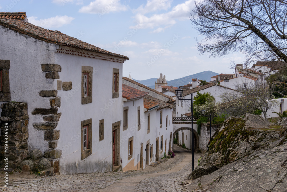 cobblestone street and historic whitewashed houses in the old city center of Marvao