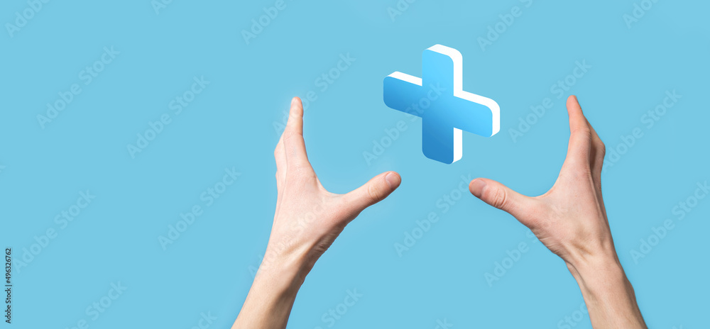 Businessman hold 3D plus icon, man hold in hand offer positive thing such as profit, benefits, development, CSR represented by plus sign.The hand shows the plus sign Businessman hold 3D plus icon, man hold in hand offer positive thing such as profit, benefits, development, CSR represented by plus sign.The hand shows the plus sign