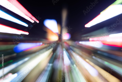 Blurred traffic light in modern city night