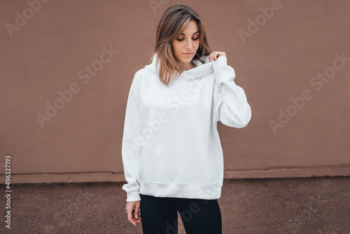Attractive woman in white hoodie, mockup 