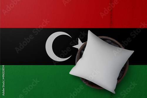 Patriotic pillow mock up on background in colors of national flag. Libyan Arab Jamahiriya photo