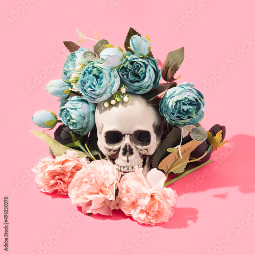 Fototapeta Naklejka Na Ścianę i Meble -  Colorful flowers bouquet with human skull in the center. Tattoo, contrast conceptual background.