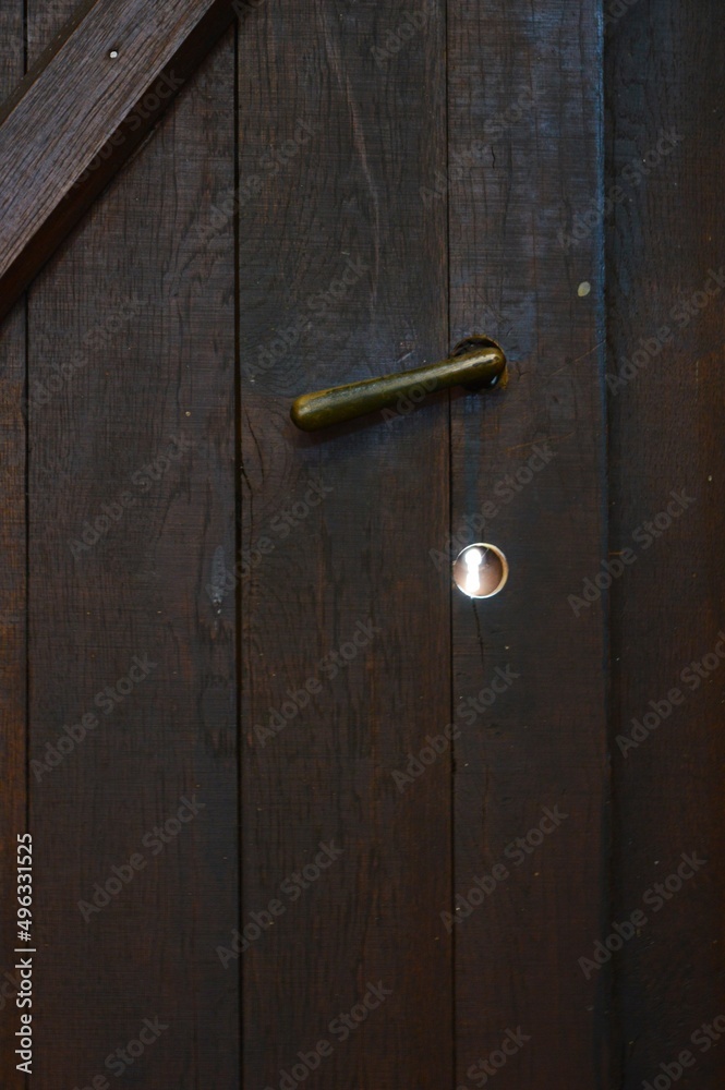 Fototapeta premium an old wooden brown door to the church