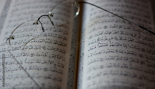 glasses over the open Koran