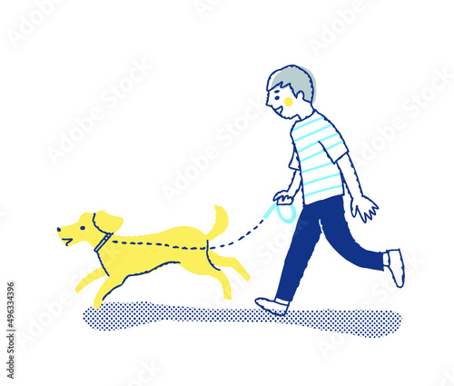 犬と散歩をしている若い男性