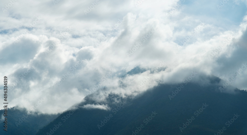 Fototapeta premium Jade Dragon Snow Mountain covered with fog