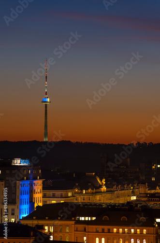 Vilnius tv tower illuminated by yellow and blue after sunset