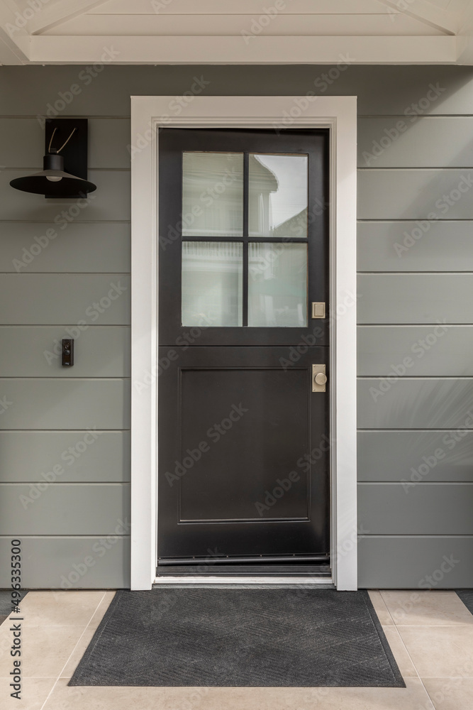 Fototapeta premium Brown front door with 4 panes of glass. Front door of house.