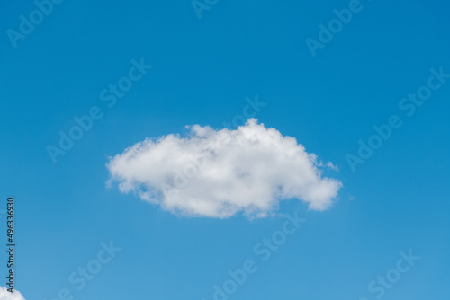 Single white cloud on blue sky