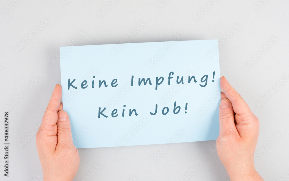 Paper wih the words no vaccine, no job, mandatory syringe for covid-19, employee termination for anti jab, german langauge
