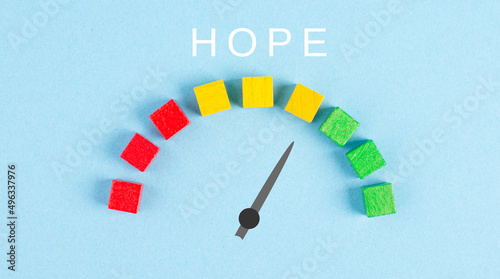 The word hope is standing on a paper, positive mindset, optimism for the future, progress bar, having faith and spirituality
