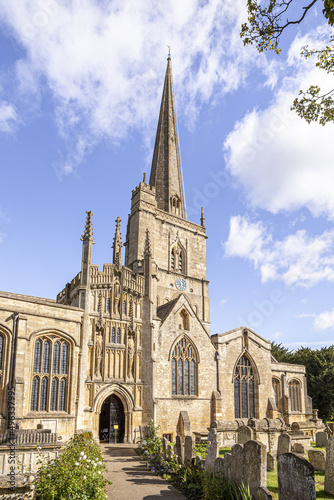 The parish church of St John the Baptist in the Cotswold town of Burford, Oxfordshire, England UK