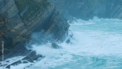 Waves and coastal landscape at Portio Beach. Natural Park of the Dunes of Liencres, Liencres, Piélagos Municipality, Cantabrian Sea, Cantabria, Spain, Europe. photo