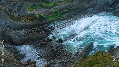 Waves and coastal landscape at Portio Beach. Natural Park of the Dunes of Liencres, Liencres, Piélagos Municipality, Cantabrian Sea, Cantabria, Spain, Europe. photo