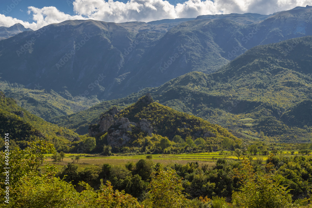 Fototapeta premium Beautiful mountain valley with gentle hills and agricultutal filds