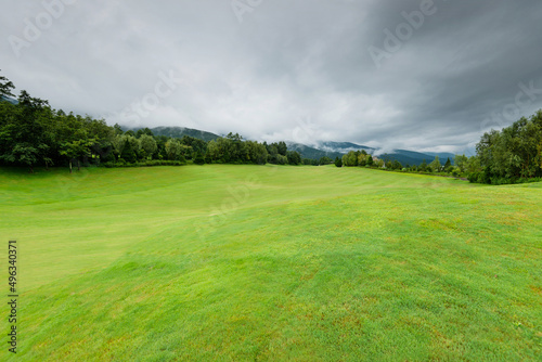 Fototapeta Naklejka Na Ścianę i Meble -  Cloudy sky over the golf course