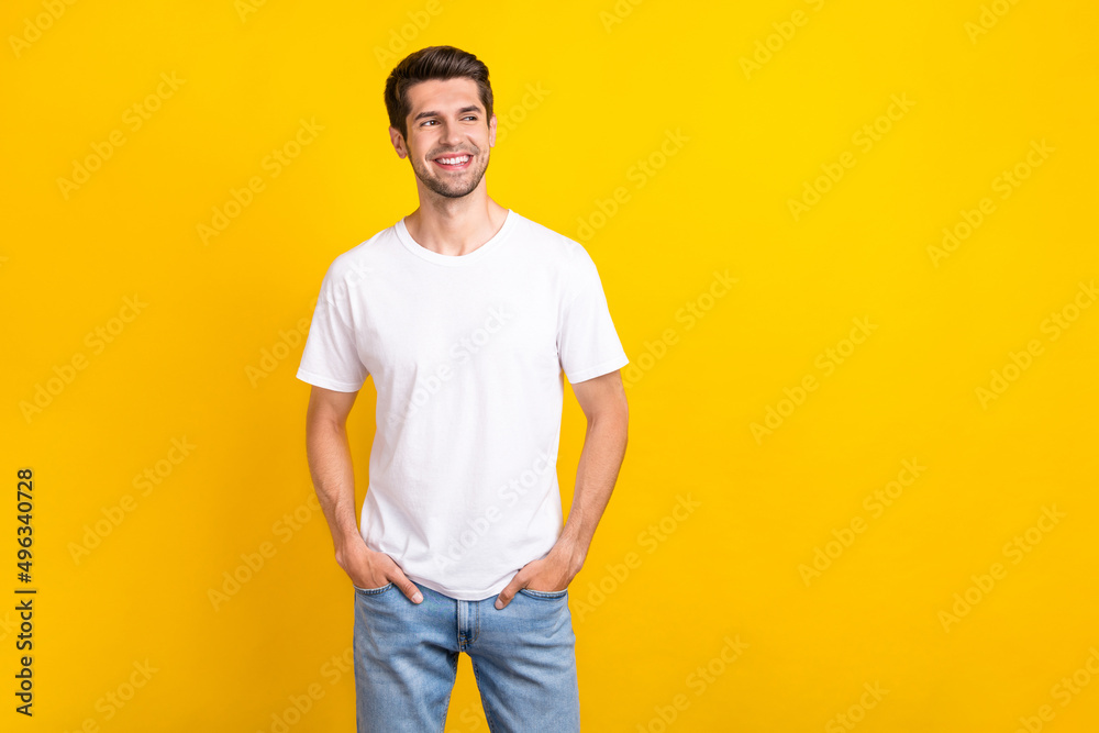 Fototapeta premium Photo of interested millennial brunet guy look promo wear casual cloth isolated on yellow color background